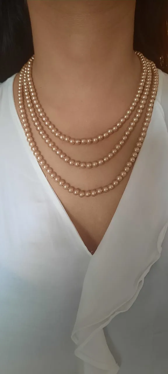 Estele gold pearl three layered necklace